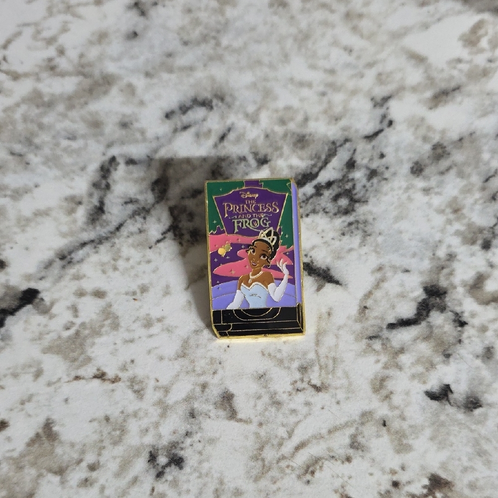 Disney Princess and the Frog VHS Enamel Pin with Purple and Gold
